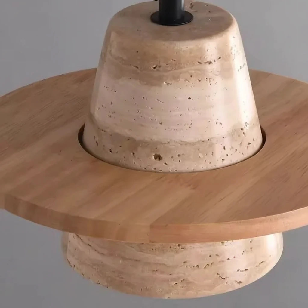 Wabi-Sabi Travertine Stone Pendant Light in warm light 3000k above a kitchen island