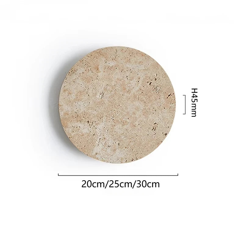 Wabi-Sabi Travertine Stone Wall Sconce in neutral light 4000k in a living room