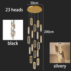 Modern LED Staircase Pendant Chandelier in warm white above a kitchen island