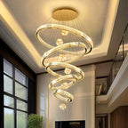 Modern Crystal Staircase Chandelier in gold 3 rings in a dining room