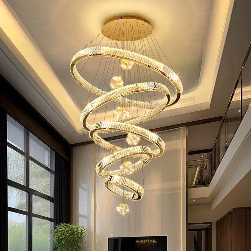 Modern Crystal Staircase Chandelier in gold 3 rings in a dining room