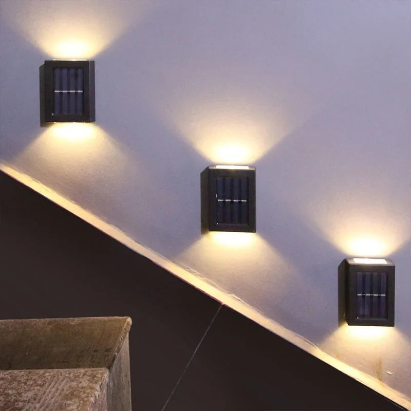 Solar Up & Down Outdoor Wall Lamp in white light in a stairwell