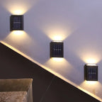 Solar Up & Down Outdoor Wall Lamp in white light in a stairwell