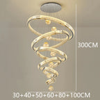 Modern Crystal Staircase Chandelier in warm white above a stairwell
