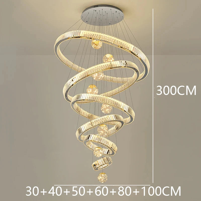Modern Crystal Staircase Chandelier in warm white above a stairwell