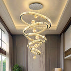 Modern Crystal Staircase Chandelier in gold 4 rings in an entryway