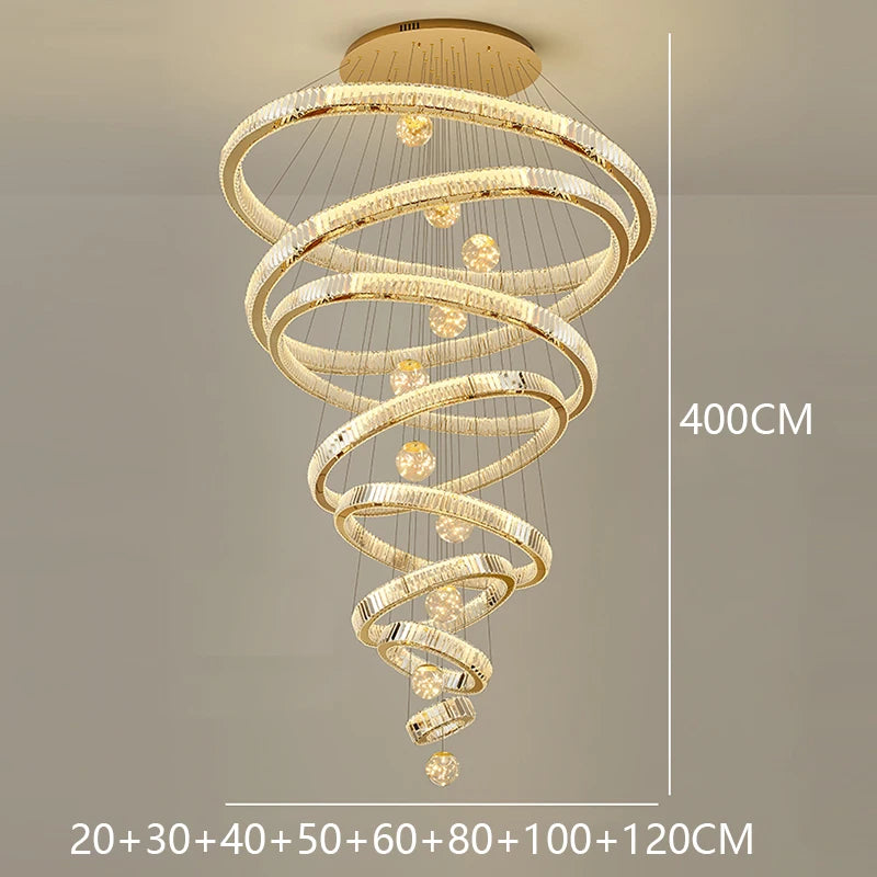 Modern Crystal Staircase Chandelier in remote dimming above a stairwell