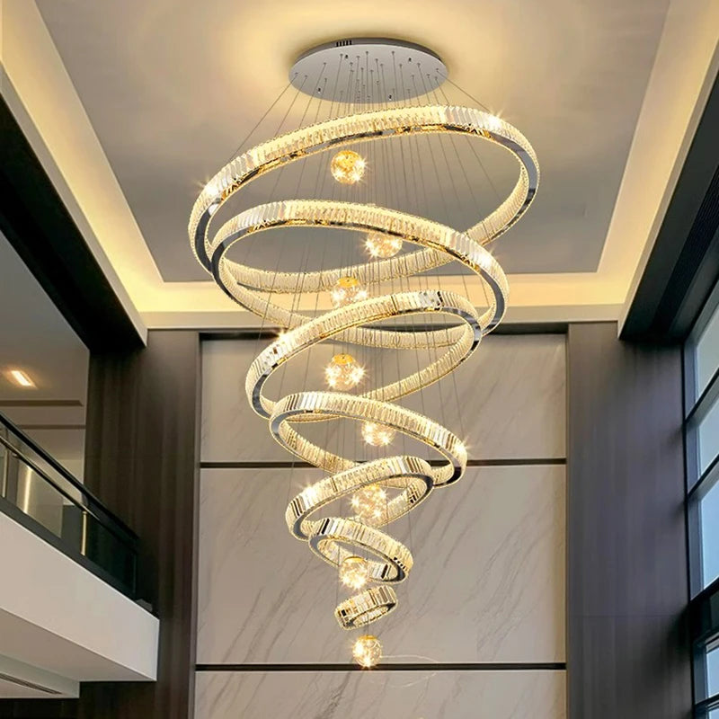 Modern Crystal Staircase Chandelier in gold 5 rings in an entryway