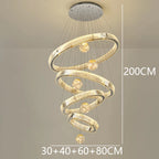 Modern Crystal Staircase Chandelier in gold 8 rings in a dining room