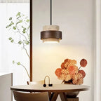 Travertine Cave Stone Pendant Chandelier in warm light 3000k over a dining table