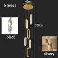 Modern LED Staircase Pendant Chandelier in black in an entryway