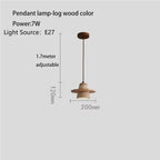 Wabi-Sabi Travertine Stone Pendant Light in d-128 walnut over a dining table