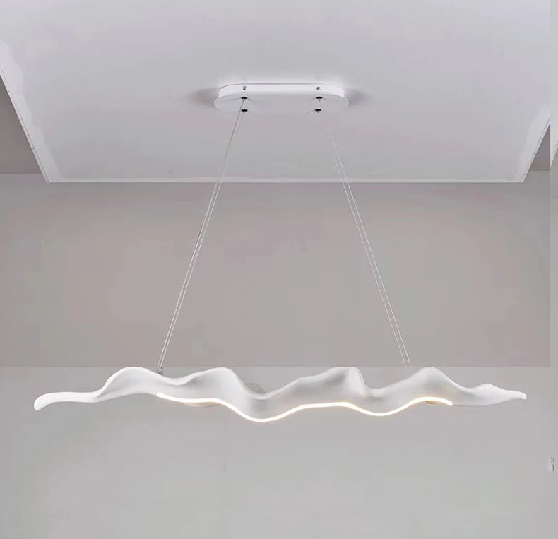 Vintage Resin Leaf Pendant Light in wood color in a living room