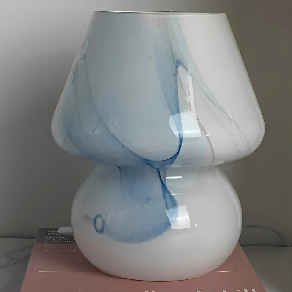 Aesthetic Glass Mushroom Lamp - LumiMush in blue pattern on a side table