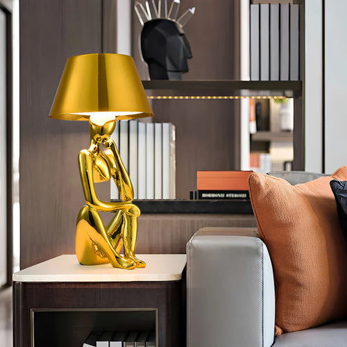 Arden Designer Lamp with Timeless Design in gold b in a bedroom