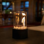 Classic Oil Lamp with Glass Chimney – Lumora Tabletop Flame Lamp in black in a living room
