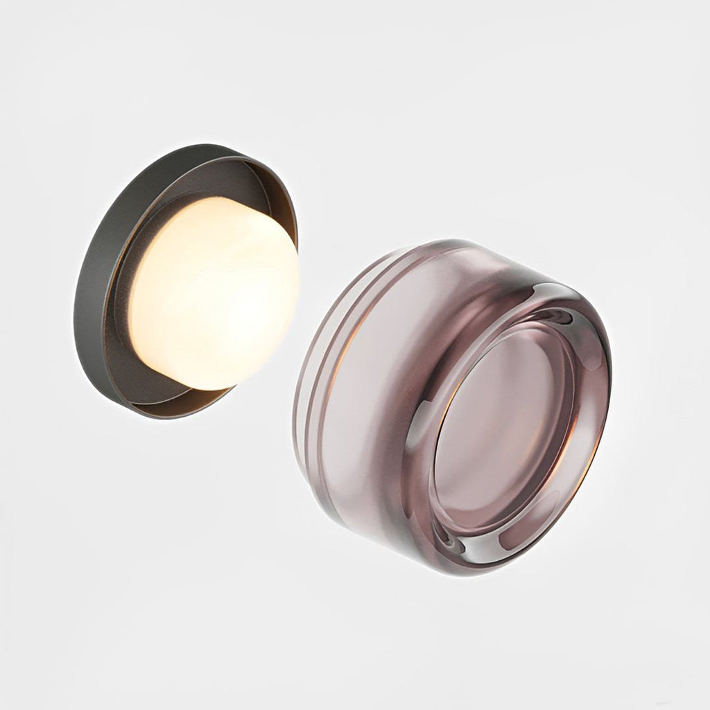 Compact Wall Light - DimpleGlow in amber along a hallway