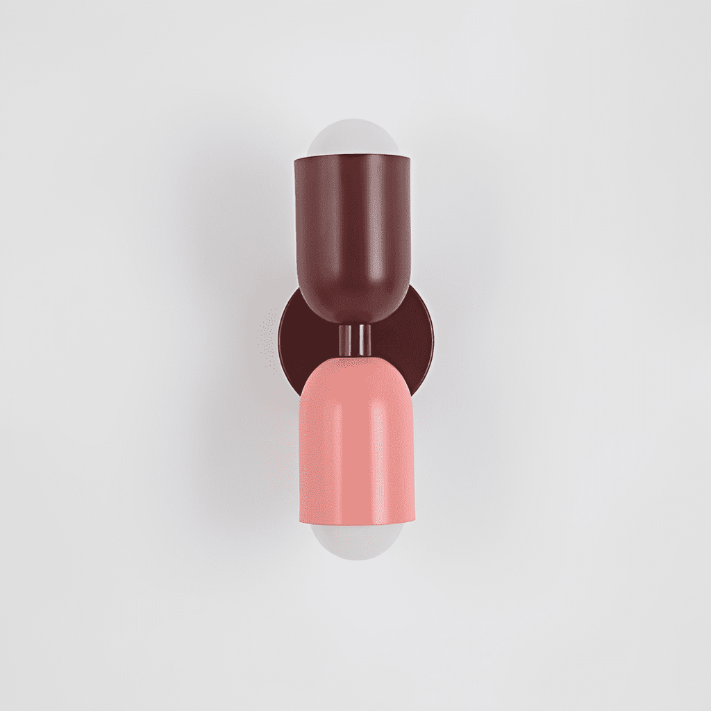 Colourful Up-Down Wall Lamp – Colorwave Double-Sided LED Sconce in pink beside a bed