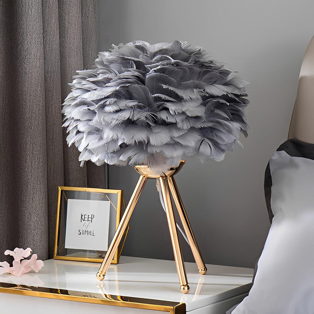 Feather Table Lamp – Pluma Dimmable Ambient Bedside Light in white on a bedside table
