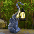 Elephant Glow Solar Garden Light along a pathway