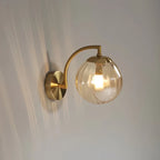Coloured Glass Wall Lamp – CrystalGlow Modern LED Sconce in blue by an entryway