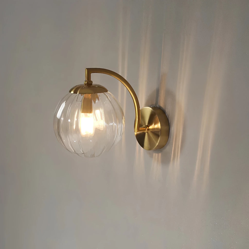 Coloured Glass Wall Lamp – CrystalGlow Modern LED Sconce in coffee beside a bed