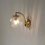 Coloured Glass Wall Lamp – CrystalGlow Modern LED Sconce in coffee beside a bed