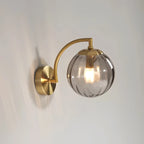 Coloured Glass Wall Lamp – CrystalGlow Modern LED Sconce in red beside a bed