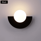 Crescent Moon Wall Lamp – LunaMetal Metal LED Sconce in white beside a bed