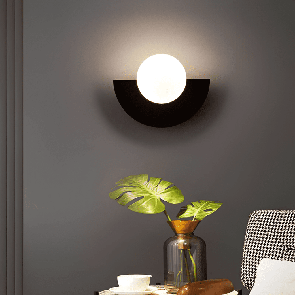 Crescent Moon Wall Lamp – LunaMetal Metal LED Sconce in green in a living room