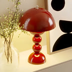 Flower Bud Table Lamp – FloraGlow Dimmable Scandinavian Light in black on a bedside table