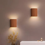 STYLISH RESIN WALL LAMPS - LUMIRESIN in white beside a bed